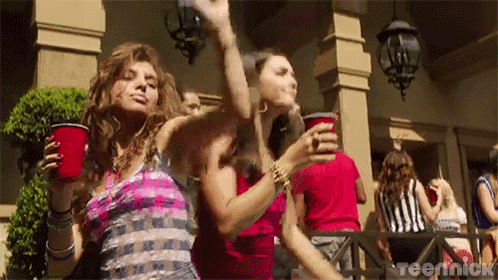 Women Dancing and Drinking Red Cups
