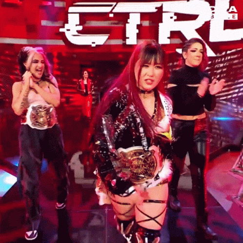 Women Dancing in Front of Ctrl Sign