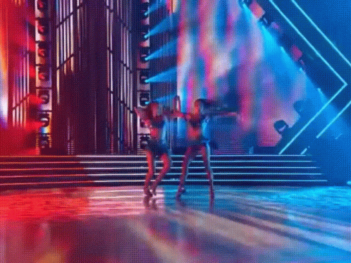 Women Dancing on Stage in Front of ABC Sign