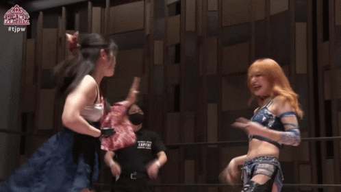 Women Holding Championship Belt On Stage GIF