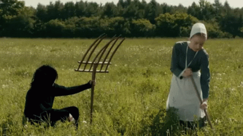 Women Holding Pitchforks