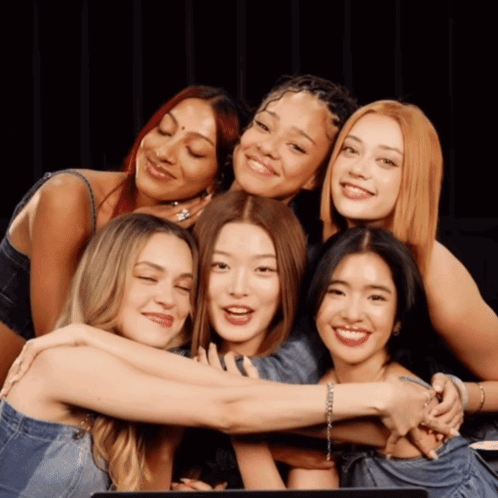 Women Hugging and Smiling