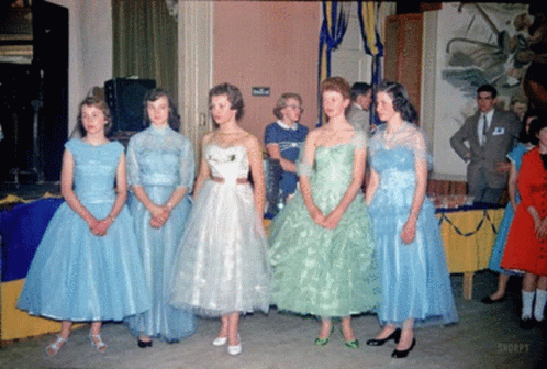 Women in Blue and Green Dresses