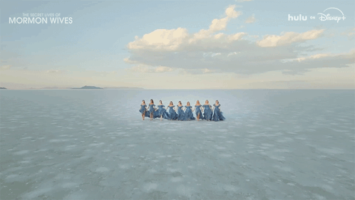 Women in Blue Dresses Holding Hands The Secret Lives of Mormon Wives