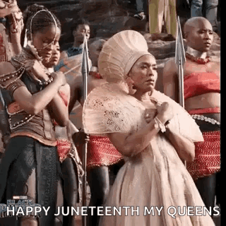 Women In Crowd Holding Spears GIF
