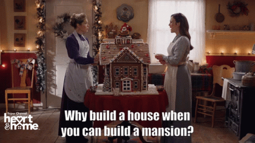 Women In Front Of Gingerbread House GIF