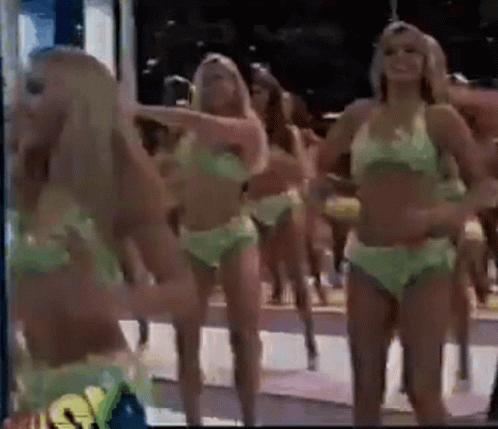 Women in Green Bikinis Dancing