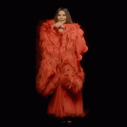 Women in Red Feathered Dresses