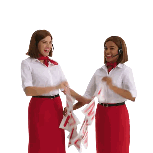 Women in Red Skirts Holding A and C Signs