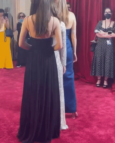 Women on Red Carpet One Wearing Mask