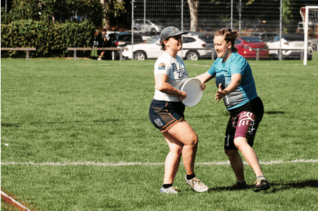 Women Playing Frisbee in Number 32 Shirt