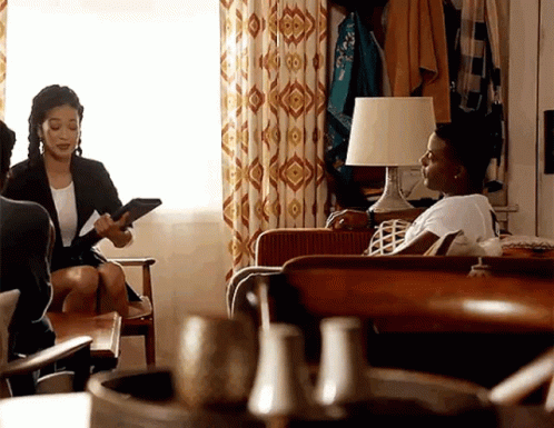 Women Sitting on Couch Talking