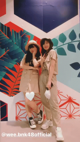 Women Standing in Front of Wee.bnk48 Official