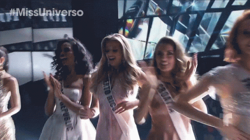 Women Wearing Sashes Saying Rio Big