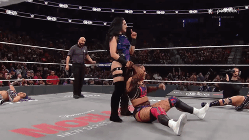 Women Wrestling in Ring With Peacock Logo