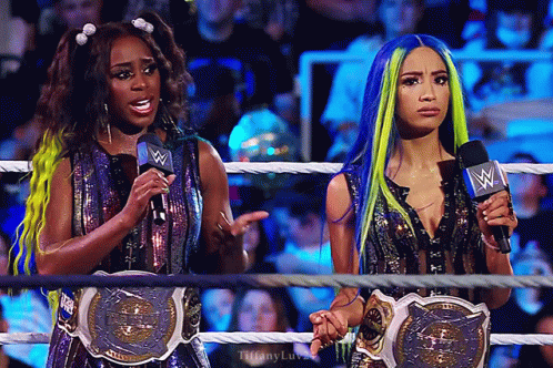 Women Wrestling Ring Holding Microphones GIF