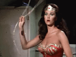 Wonder Woman Is Holding A Rope In Her Hand . GIF