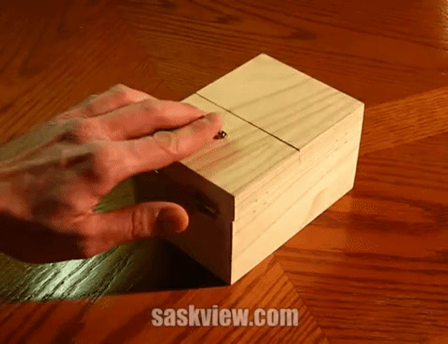 Wooden Box With Robotic Hands GIF