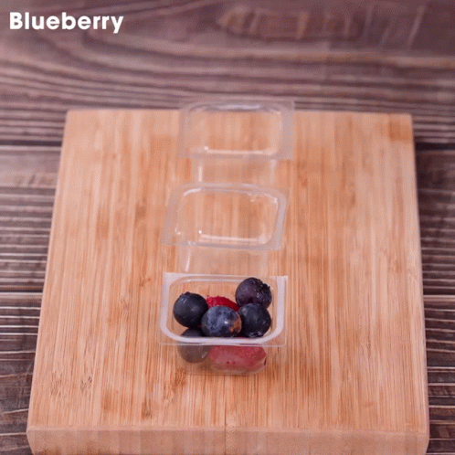 Wooden Cutting Board With Blueberries and Raspberries