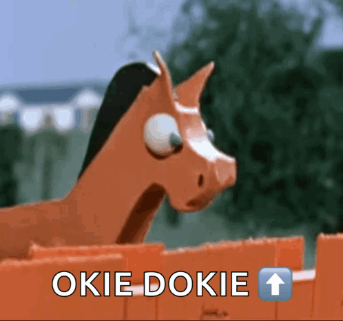 Wooden Horse Behind Fence with Okie Dokie