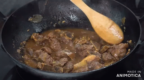 Wooden Spoon Stirring Stew Says Made in Animotica