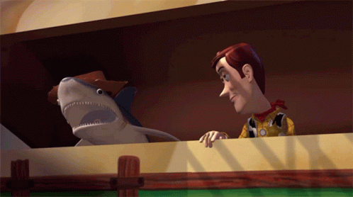 Woody And A Stuffed Shark From Toy Story GIF