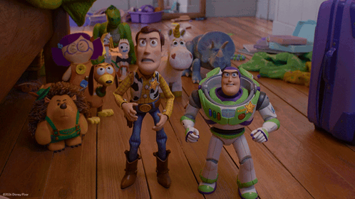 woody and buzz lightyear are standing next to each other in a scene from toy story