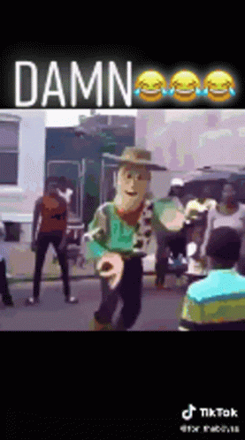Woody Doll Dancing in Street Before Crowd