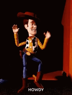 Woody From Toy Story Is Dancing In Front Of A Red Building . GIF
