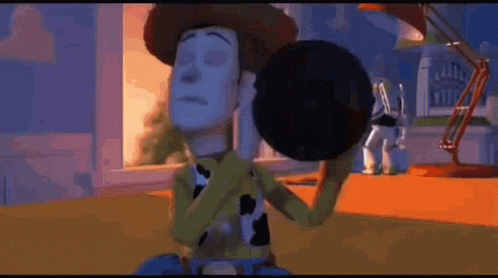 woody from toy story is holding buzz lightyear in his arms