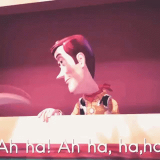 Woody From Toy Story Is Laughing While Looking Over A Table GIF