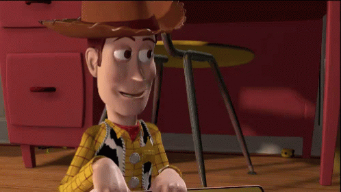 Woody From Toy Story Is Sitting On A Wooden Floor GIF