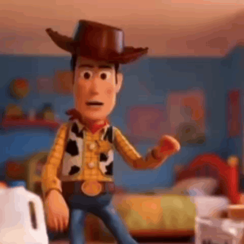 Woody From Toy Story Is Standing In A Room Holding A Red Apple . GIF