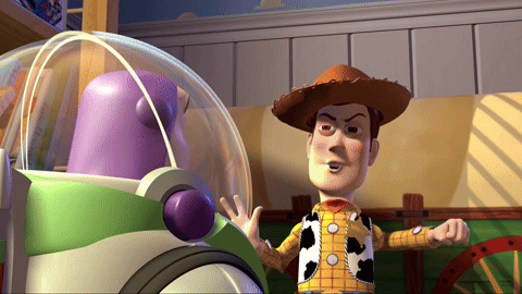 woody from toy story standing next to buzz lightyear in a room