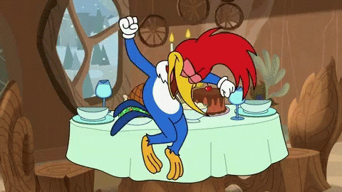 Woody Woodpecker Sitting at Table With Cake and Wine Glasses