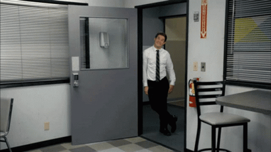 Workaholics Adam Smiling At The Door Frame GIF