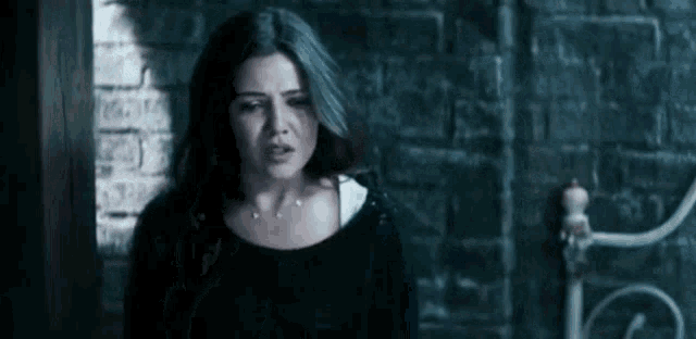 Worried Danielle Campbell With Chained Hands GIF