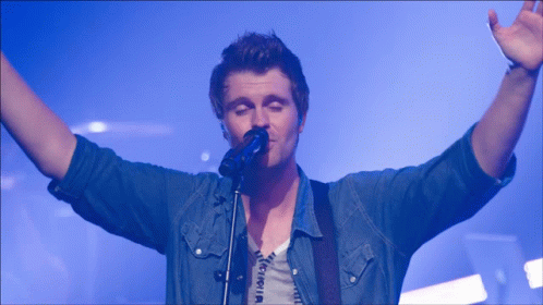 Worship Guy Raising Hand And Speaking GIF