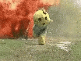 Mascot Running From Bomb Explosion GIF