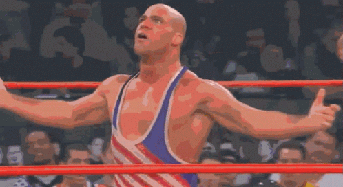 Wrestler Arms Outstretched In Ring With Crowd GIF