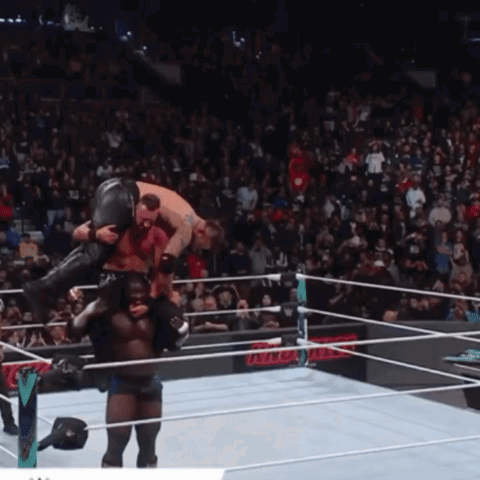 Wrestler Carrying Another Wrestler in Ring