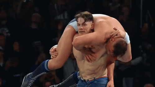 Wrestler Carrying Another Wrestler On Shoulders GIF