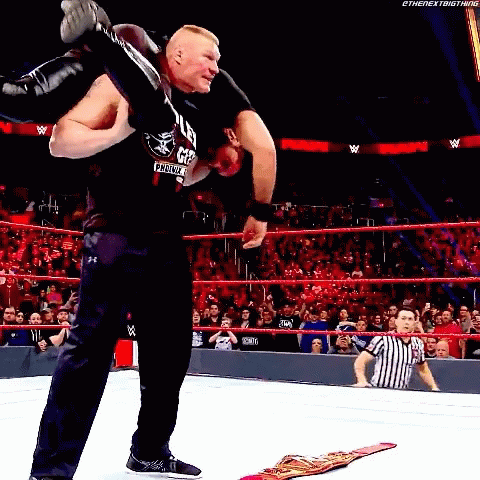 Wrestler Carrying Another Wrestler On Shoulders In Ring GIF