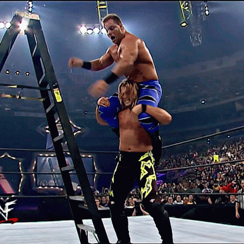 Wrestler Carrying Another Wrestler Up a Ladder