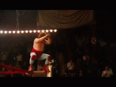 Wrestler Flying Through Air In Ring GIF