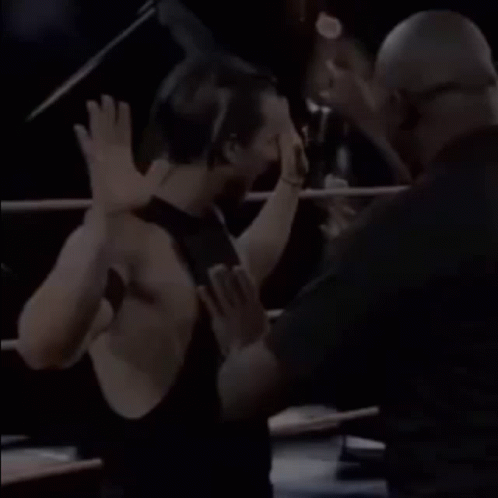 Wrestler Giving Another Wrestler a High Five
