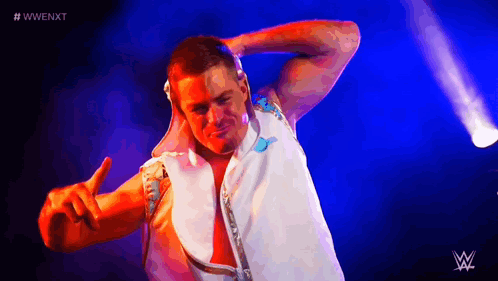 Wrestler Giving Peace Sign Purple Background GIF