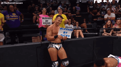 Wrestler Holding Blessed Sign GIF