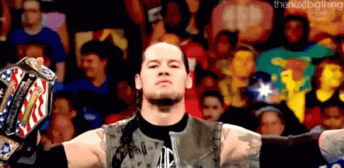 Wrestler Holding Championship Belt Before Crowd GIF