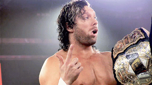Wrestler Holding Championship Belt Thumbs Up